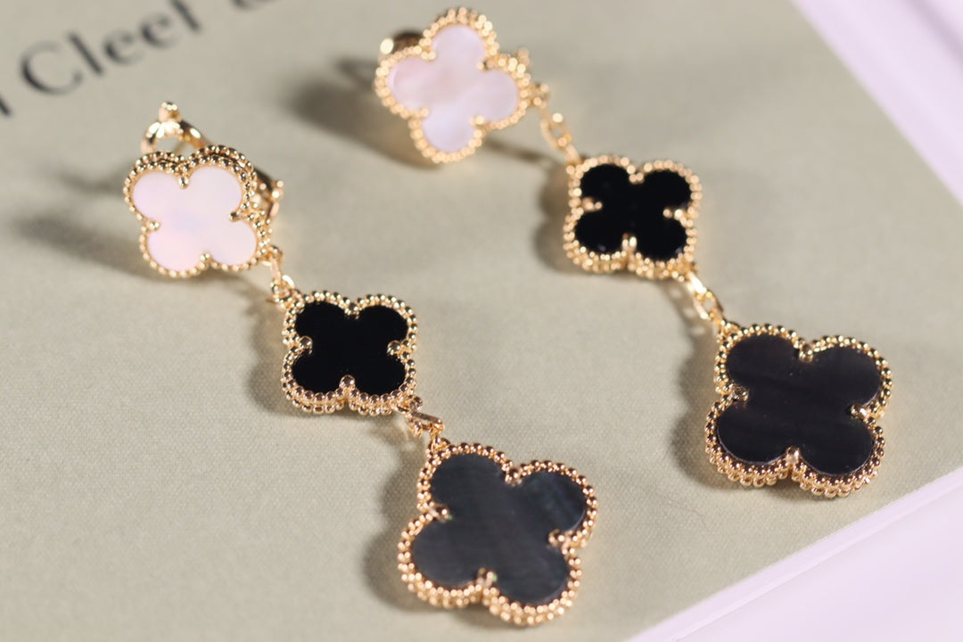 ```json
{
  "product_name": "[Clover Schmuck]KLEE OHRRINGE GOLD ONYX PERLMUTT 3 MOTIVE"
}
```